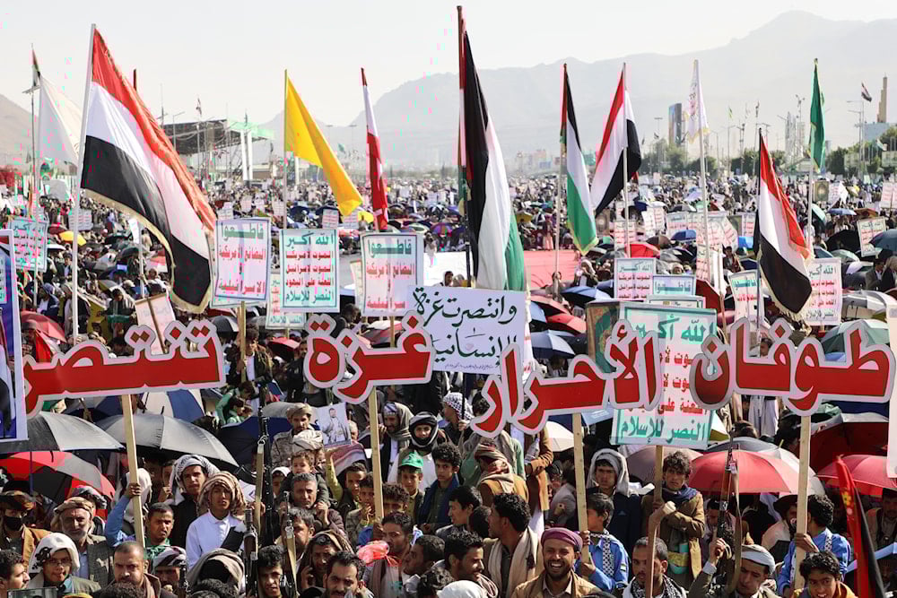 Ansar Allah supporters celebrate following the announcement that 