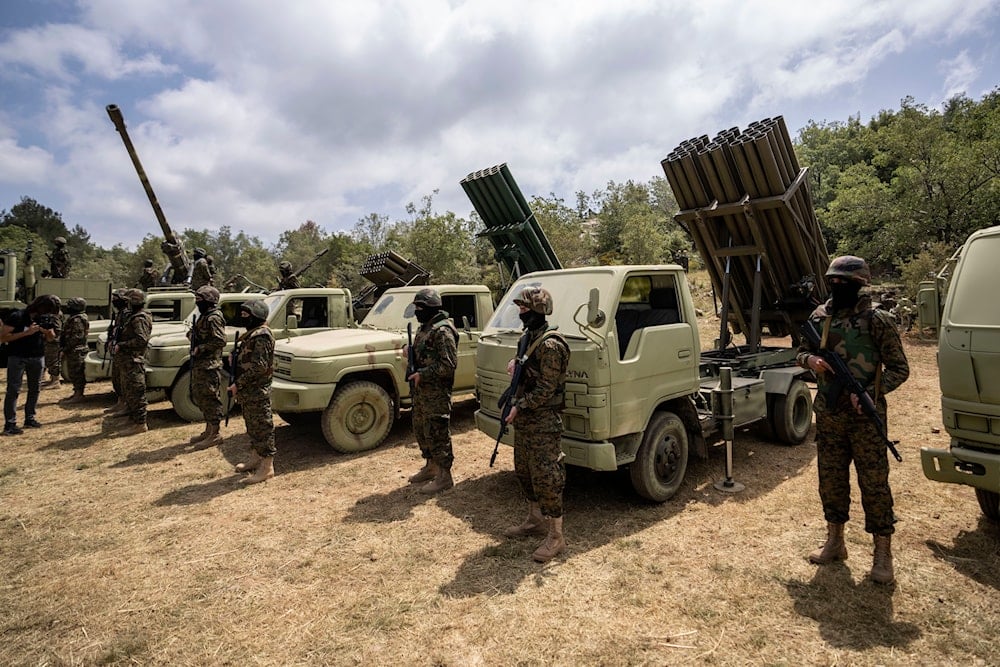 Fighters from the Lebanese militant group Hezbollah carry out a training exercise in Aaramta village in the Jezzine District, southern Lebanon, Sunday, May 21, 2023 (AP)