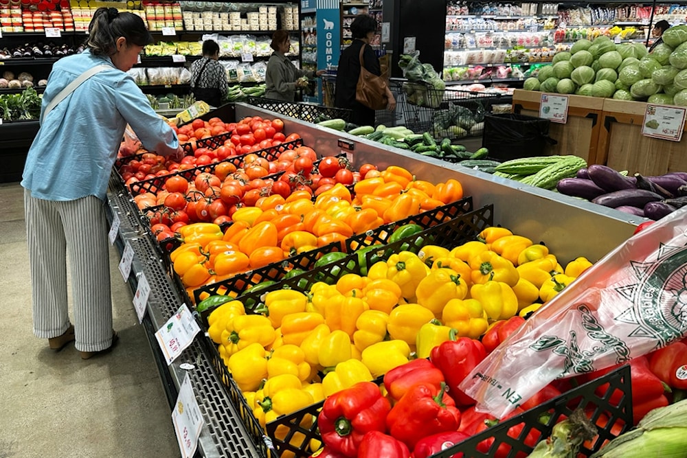 A person shops at a grocery store in Schaumburg, Ill., Thursday, September 18, 2025. (AP Photo/Nam Y. Huh)