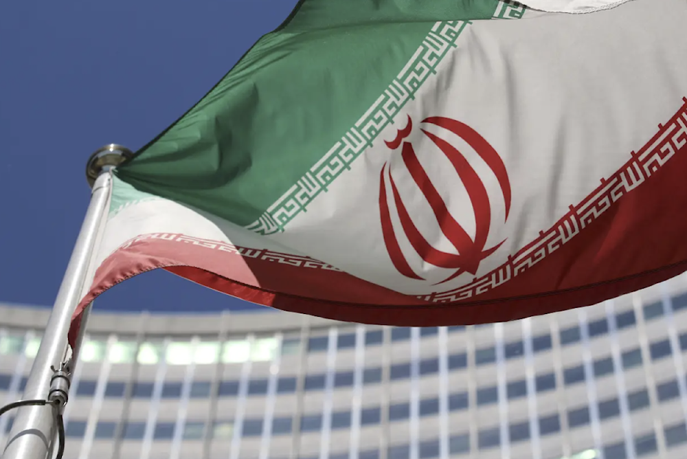 The Iranian flag flies in front of a UN building where closed-door nuclear talks take place at the International Center in Vienna, Austria, on June 18, 2014. (AP)