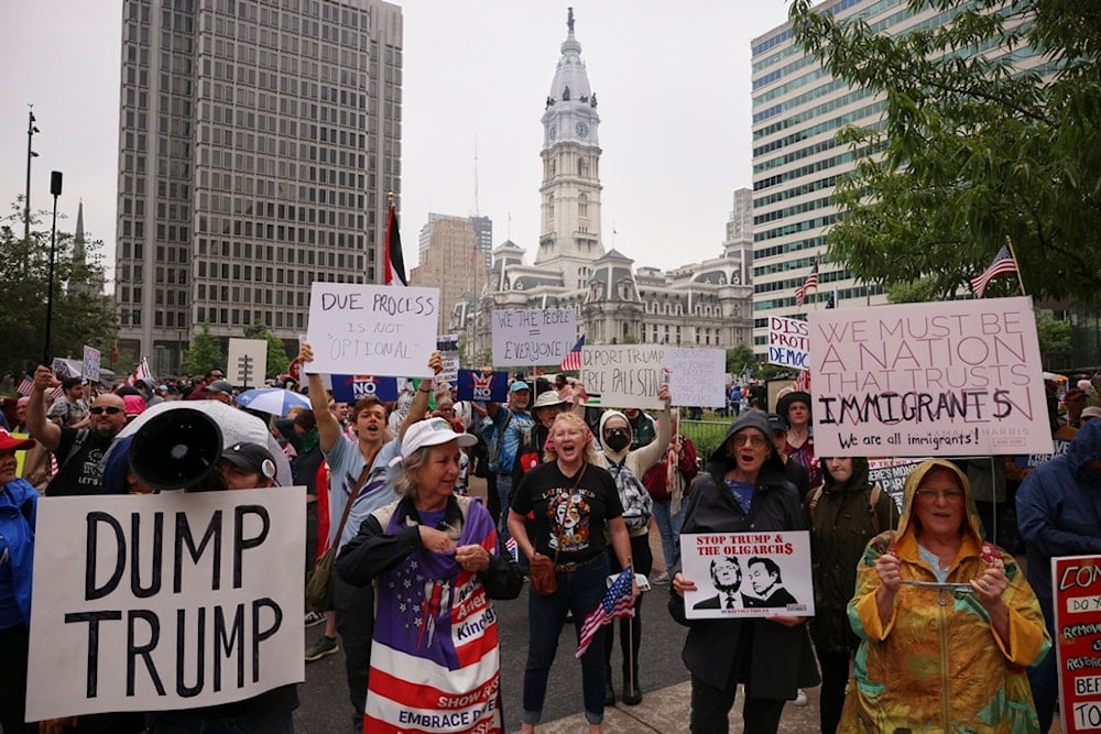Demonstrators participate in the 'No Kings' protest, Saturday, June 14, 2025, in Philadelphia (AP)