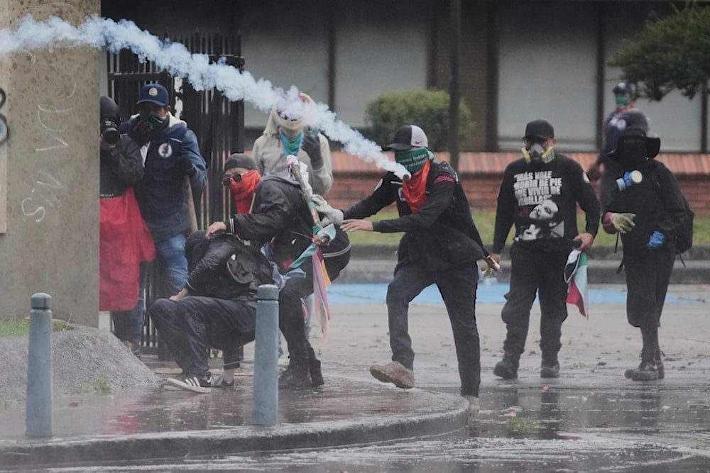 Tear gas is launched by police to disperse protesters demanding action from President Gustavo Petro's government on social, environmental, and security issues in Bogota, Colombia, Friday, October 17, 2025 (AP)