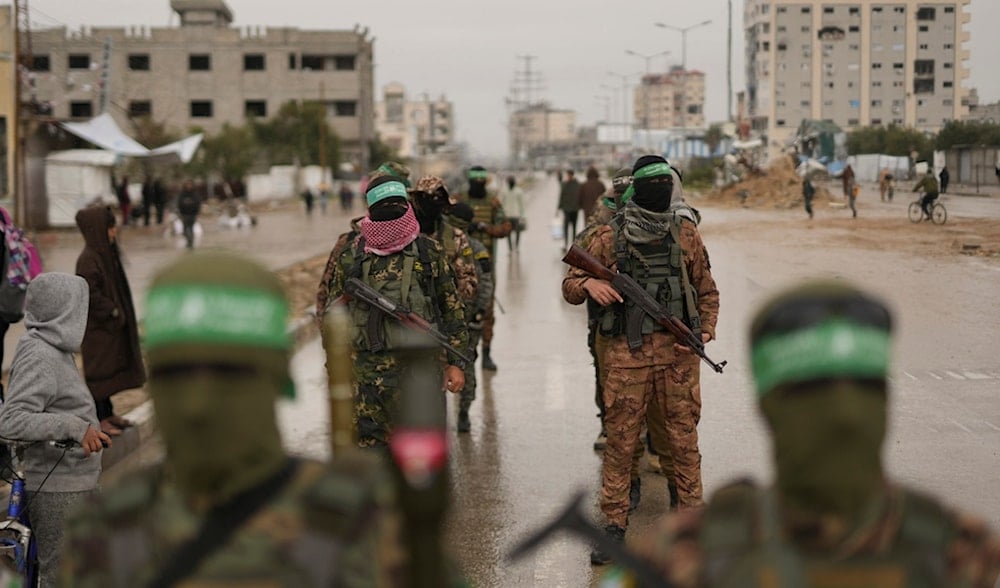 Hamas fighters take position ahead of the planned release of Israeli captives set to be handed over to the Red Cross in Nuseirat, Gaza Strip, Saturday, Feb. 22, 2025. (AP)