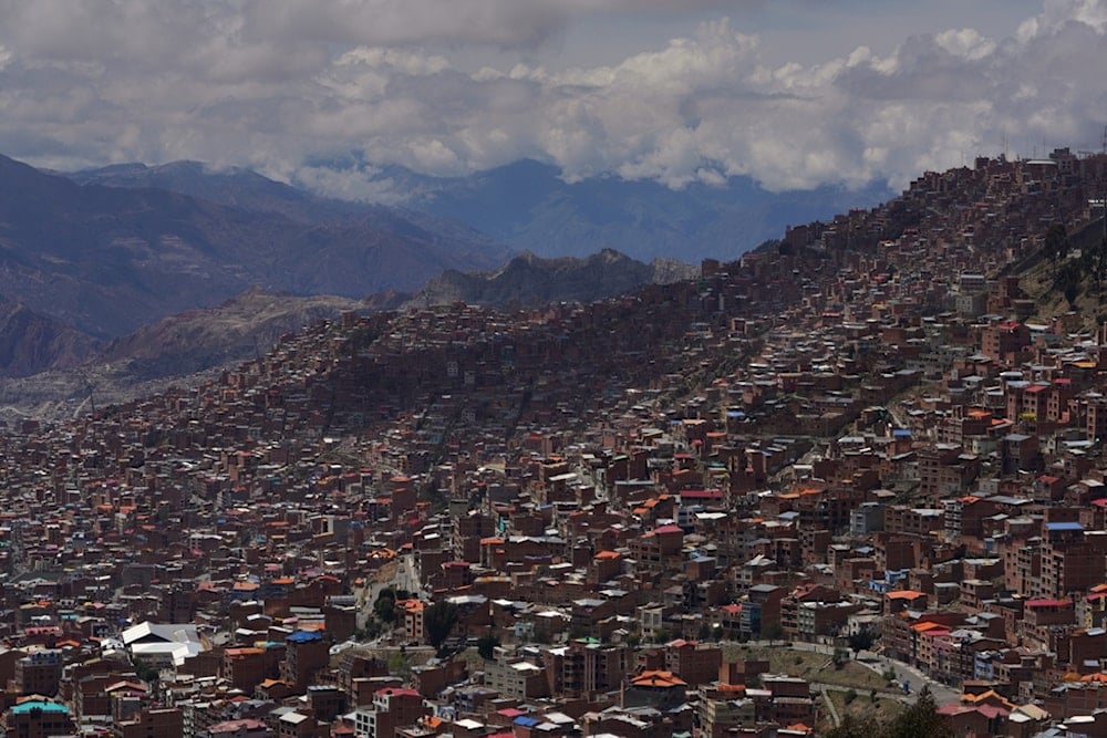 Clouds hang over the mountains surrounding La Paz, Bolivia, during a presidential runoff election, Sunday, Oct. 19, 2025. (AP Photo/Ivan Valencia)