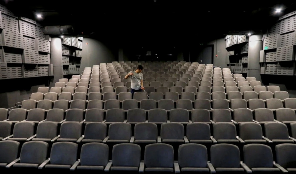 In this Monday, March 16, 2020 photo, a worker cleans an empty and closed cinema hall in Tehran, Iran (AP)