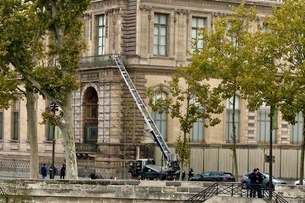 A basket lift used by thieves is seen at the Louvre museum Sunday October 19, 2025 in Paris. (AP Photo/Alexander Turnbull)