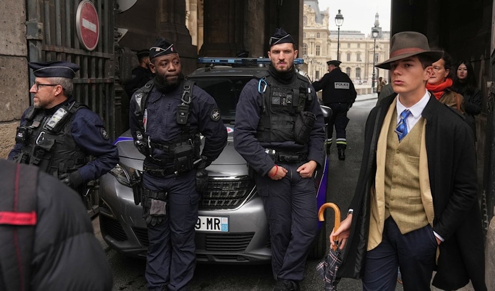 Police officers block an access to the Louvre museum after a robbery Sunday, Oct. 19, 2025 in Paris. (AP)