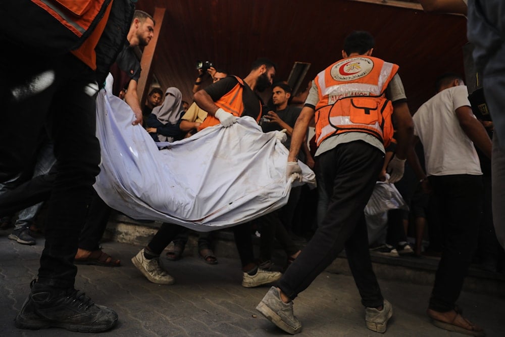 The bodies of Palestinians, killed by Israeli fire after crossing the ceasefire line according to the Hamas-run Civil Defense, are brought to Al Ahli Hospital in Gaza City, on October 18, 2025. (AP Photo/Yousef Al Zanoun)