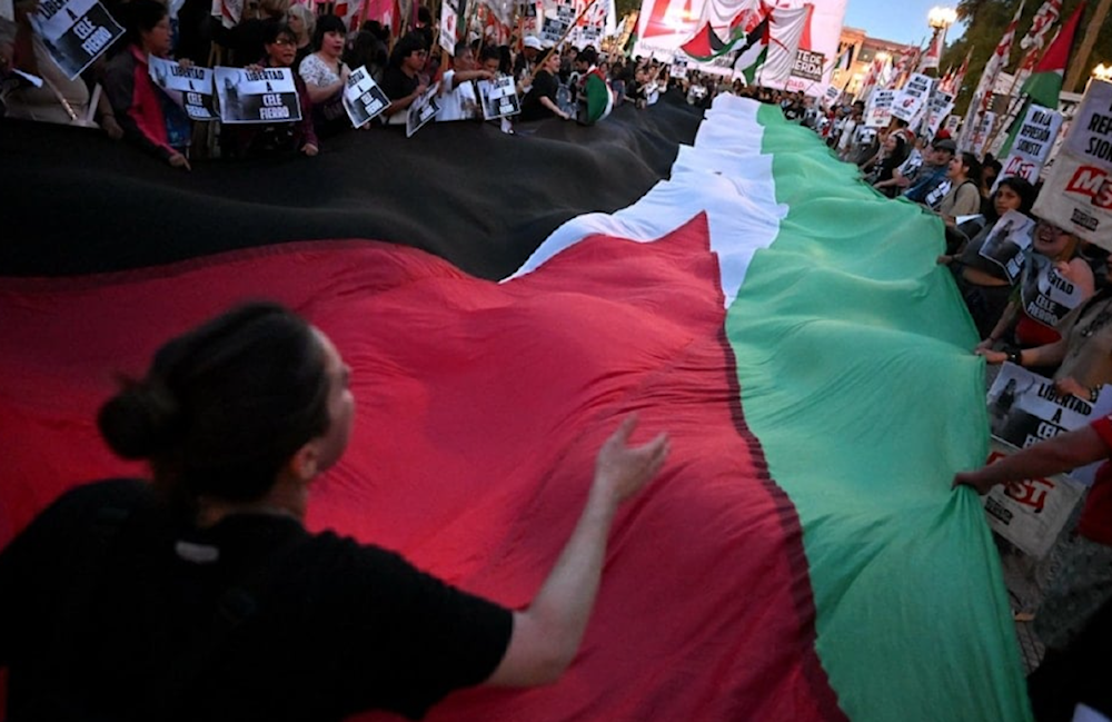 Demonstrators protest the Israeli occupation's interception of the Global Sumud Flotilla in Buenos Aires, Argentina. (AFP)