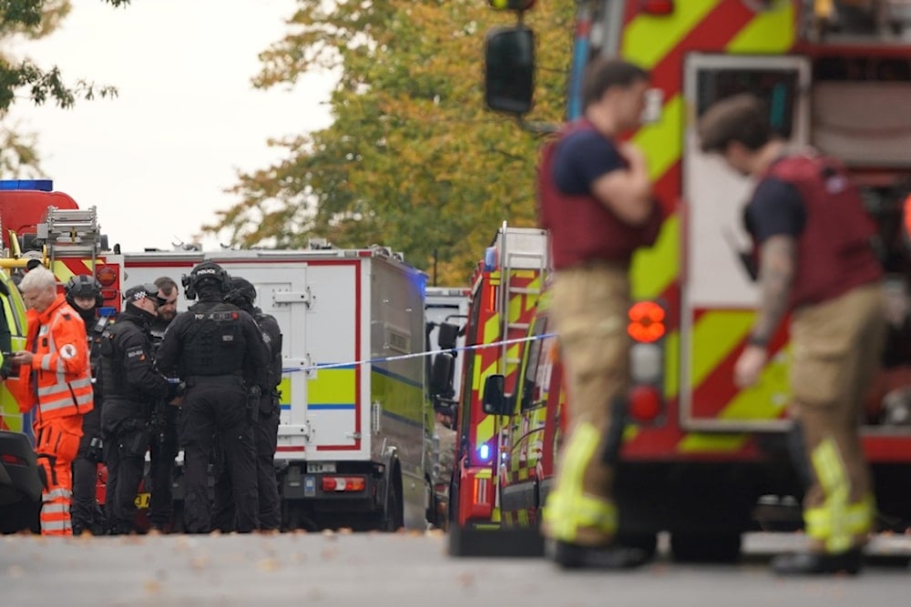 Emergency service workers at the scene of a stabbing incident at Heaton Park Hebrew Congregation synagogue, in Crumpsall, Manchester, England, Thursday, October 2, 2025 (AP)