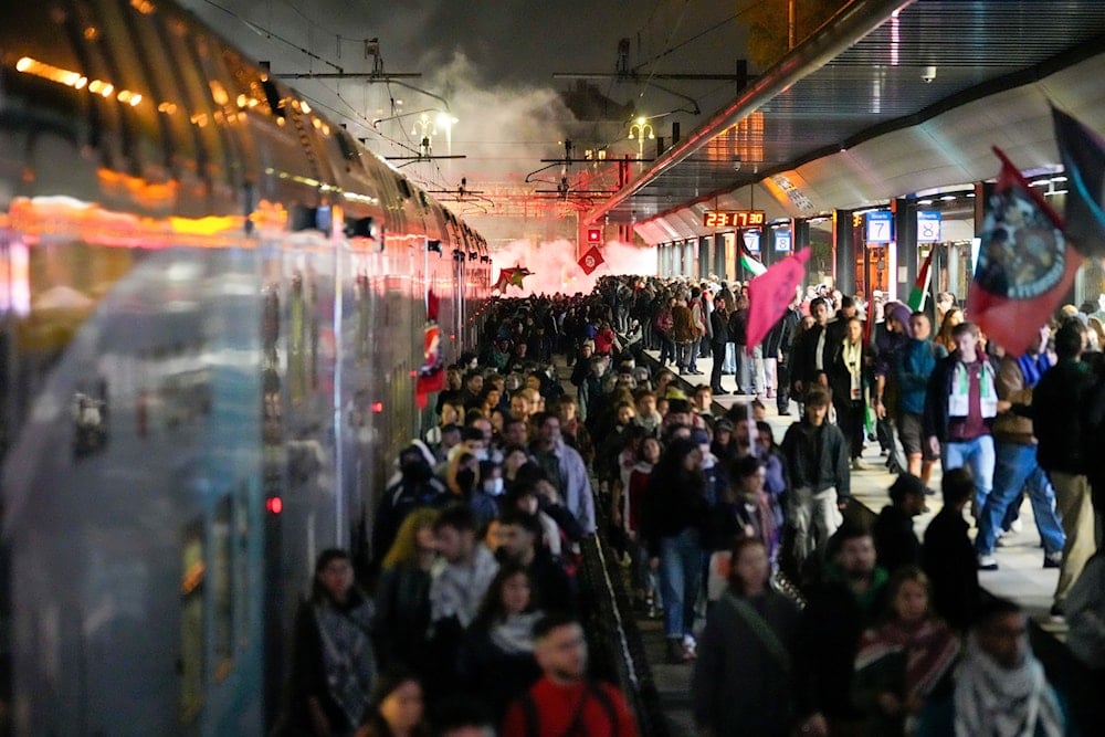 Pro-Palestinian demonstrators flood the rail track at Milan's Cadorna railway station, Italy, late Wednesday, Oct. 1, 2025 (AP)