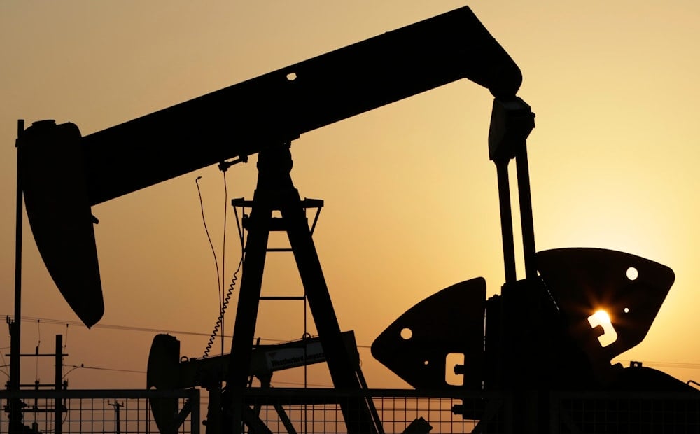 In this Sept. 30, 2015, file photo, oil pumps work in the desert oil fields of Sakhir, Bahrain (AP)