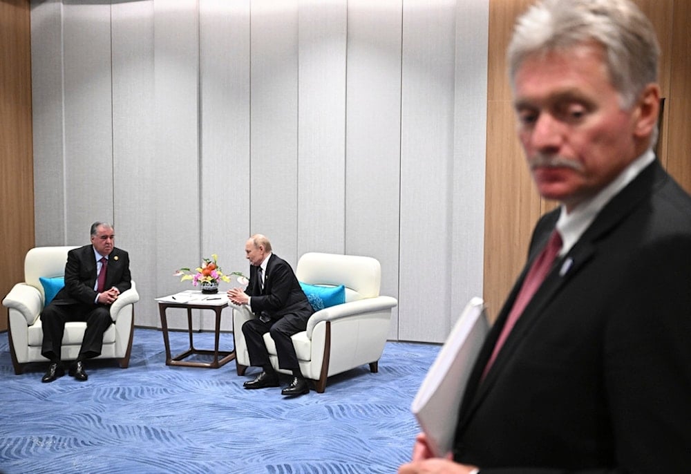 Russian President Vladimir Putin and Tajik President Emomali Rahmon, left, talk as Kremlin spokesman Dmitry Peskov stands nearby, in Tianjin, China, Monday, September 1, 2025 (AP)