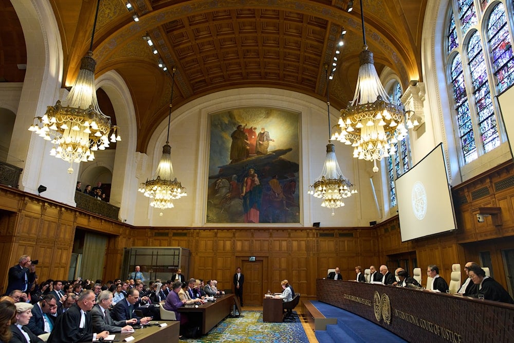 Presiding Judge Yuji Iwasawa, starts reading the advisory opinion of the ICJ on what 'Israel' must do to ensure humanitarian aid reaches Palestinians in Gaza and the occupied West Bank, in The Hague, Netherlands, Wednesday, Oct. 22, 2025 (AP)