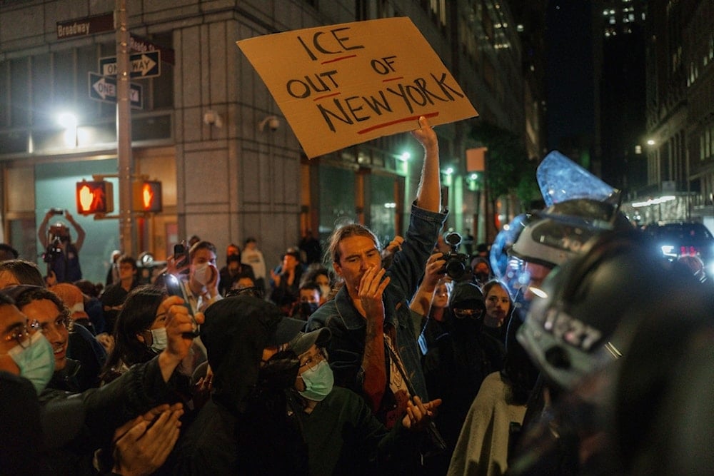 Protesters shout slogans during a protest against immigration crackdown in the aftermath of a raid on Tuesday, October 21, 2025, in New York. (AP Photo/Olga Fedorova)