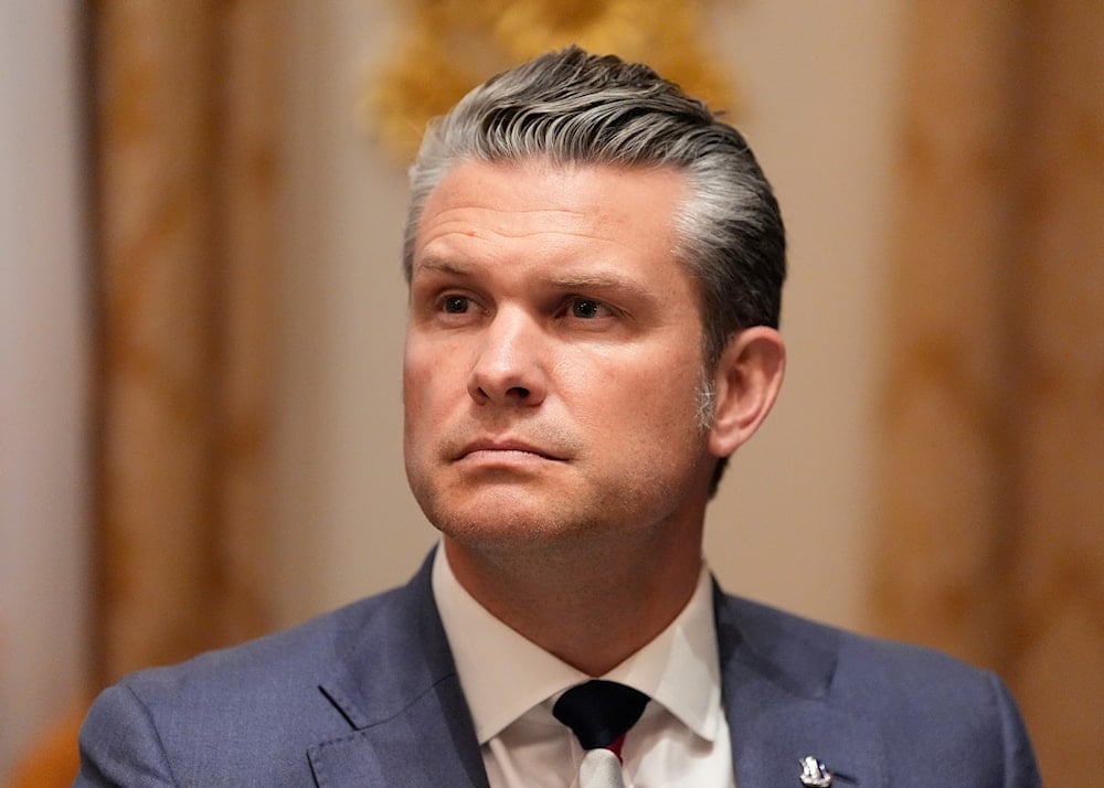 Defense Secretary Pete Hegseth listens as President Donald Trump speaks before a lunch with Ukraine's President Volodymyr Zelenskyy in the Cabinet Room of the White House, Friday, Oct. 17, 2025, in Washington (AP)