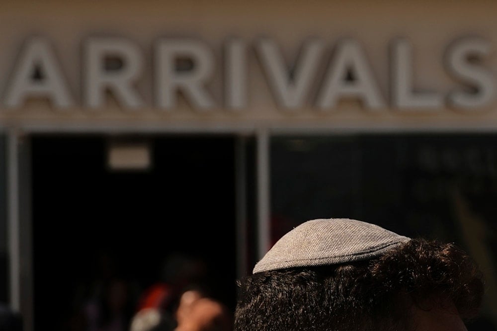 An evacuee from Israel arrives at Cyprus' main port of Limassol aboard the cruise ship Crown Iris, on Saturday, June 21, 2025.(AP Photo/Petros Karadjias)