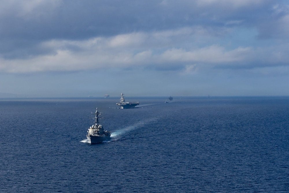 US Navy warships sail in formation during joint maritime exercises in the Caribbean Sea near the coast of Venezuela, part of ongoing operations with Trinidad and Tobago.