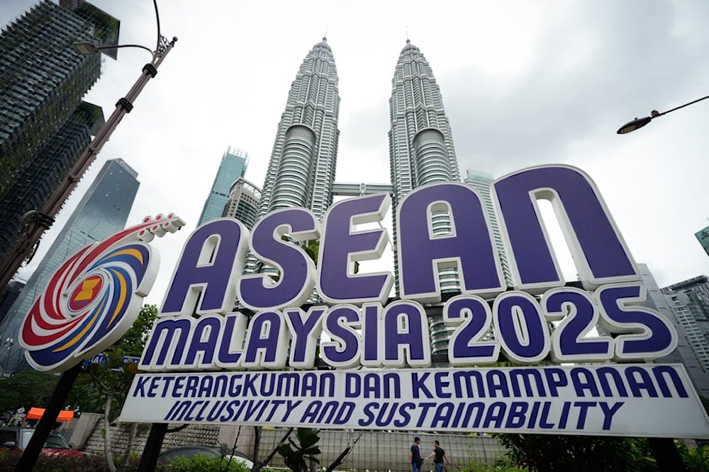The logo of the Association of Southeast Asian Nations (ASEAN) is pictured in front of Malaysia's Petronas Twin Towers ahead of the 47th ASEAN Summit in Kuala Lumpur, Malaysia, Friday, October 24, 2025. (AP Photo/Vincent Thian)