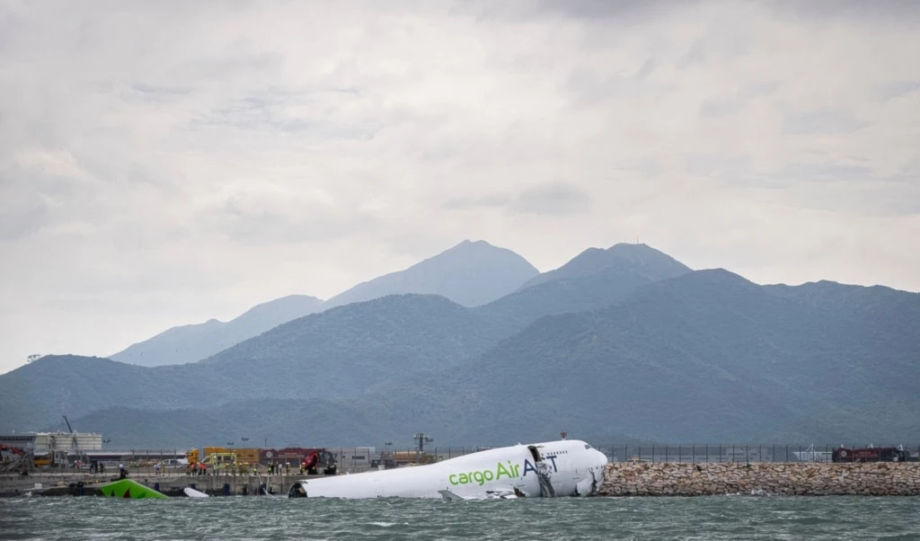The cargo aircraft that skidded off a Hong Kong airport runway is seen on Monday, October 20, 2025. (AP Photo/Chan Long Hei) The cargo aircraft that skidded off a Hong Kong airport runway is seen on Monday, October 20, 2025. (AP Photo/Chan Long Hei)