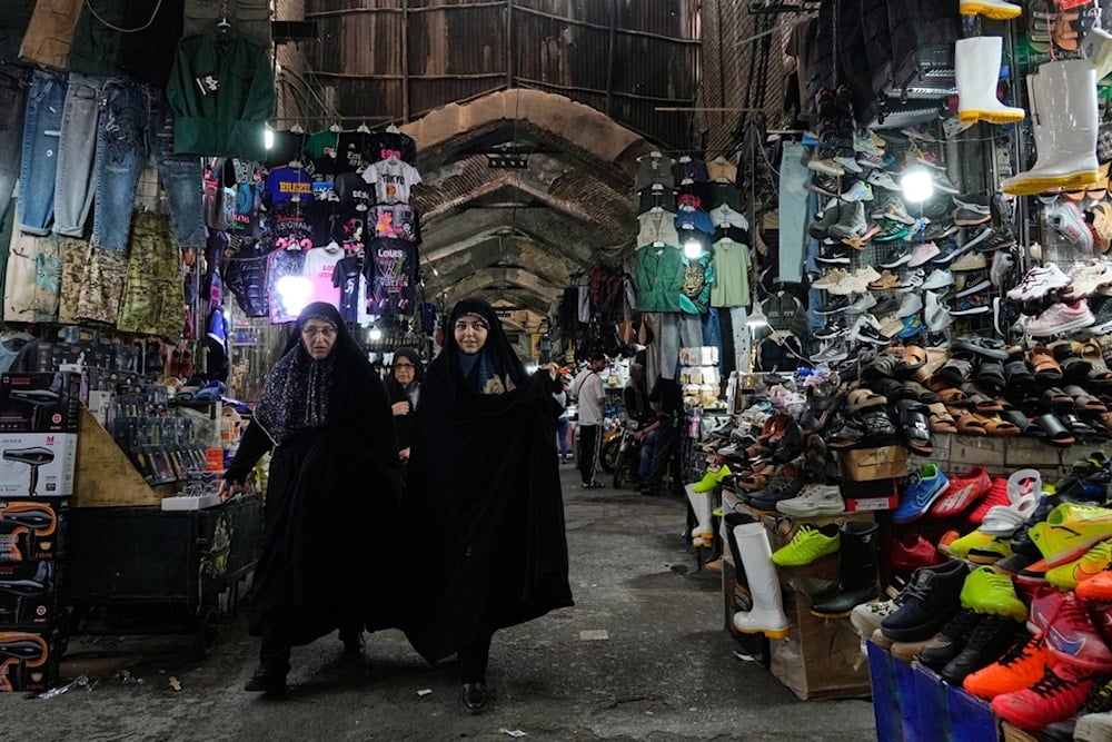 People walk along Amin ol-Soltan traditional market in Tehran, Iran, Wednesday, September 24, 2025 (AP)