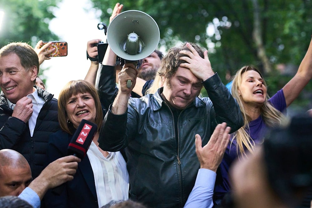 President Javier Milei holds a megaphone while leading a campaign rally ahead of mid-term elections, in Tres de Febrero, Buenos Aires province, Argentina, on October 17, 2025. (AP Photo/Rodrigo Abd)