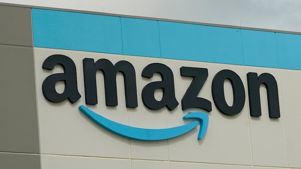 FILE - The Amazon logo is pictured at the Amazon Robotic Sorting Fulfillment Center in Madison County, Miss., Aug. 11, 2022. (AP Photo/Rogelio V. Solis, File)