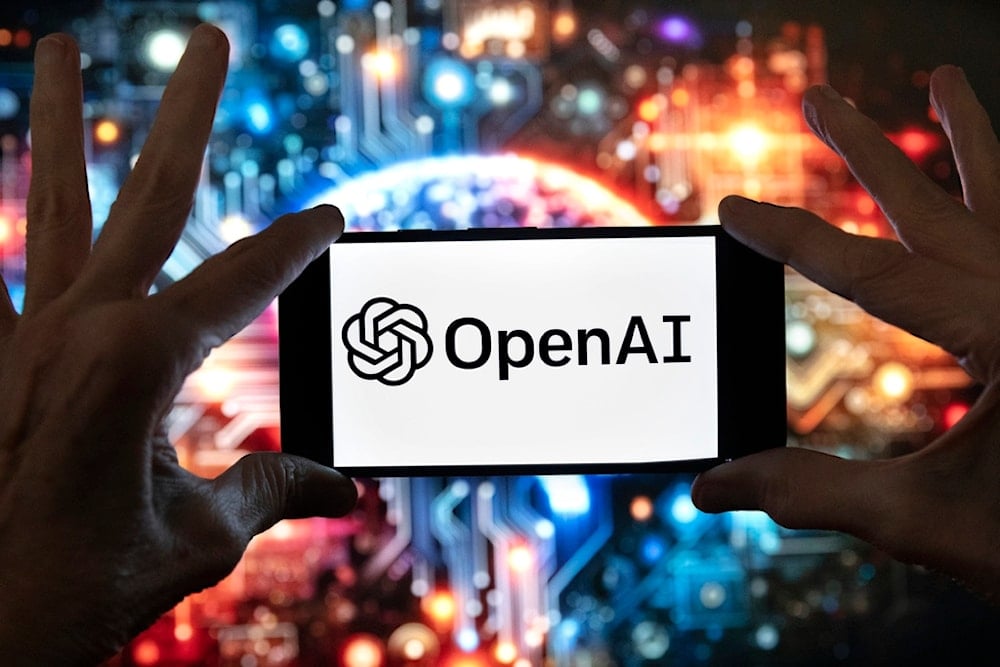 The OpenAI logo is displayed on a cell phone in front of an image generated by ChatGPT's Dall-E text-to-image model, December 8, 2023, in Boston. (AP Photo/Michael Dwyer)