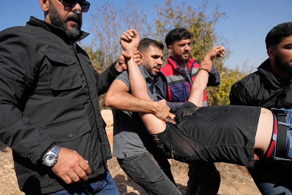 Settlers attack West Bank olive harvesters, Injure 3 Palestinians