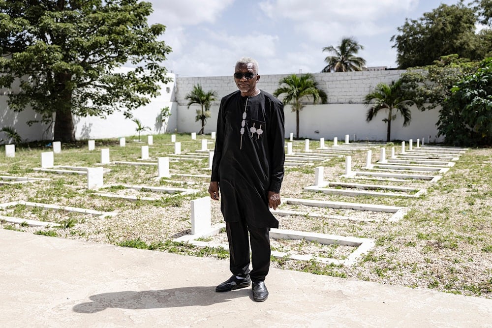 Mamadou Kone, technical advisor to the Director of Archives and Historical Heritage of the Armed Forces, poses for a portrait at the Thiaroye Military Cemetery in Dakar, on October 23, 2025. (Photo by PATRICK MEINHARDT / AFP)