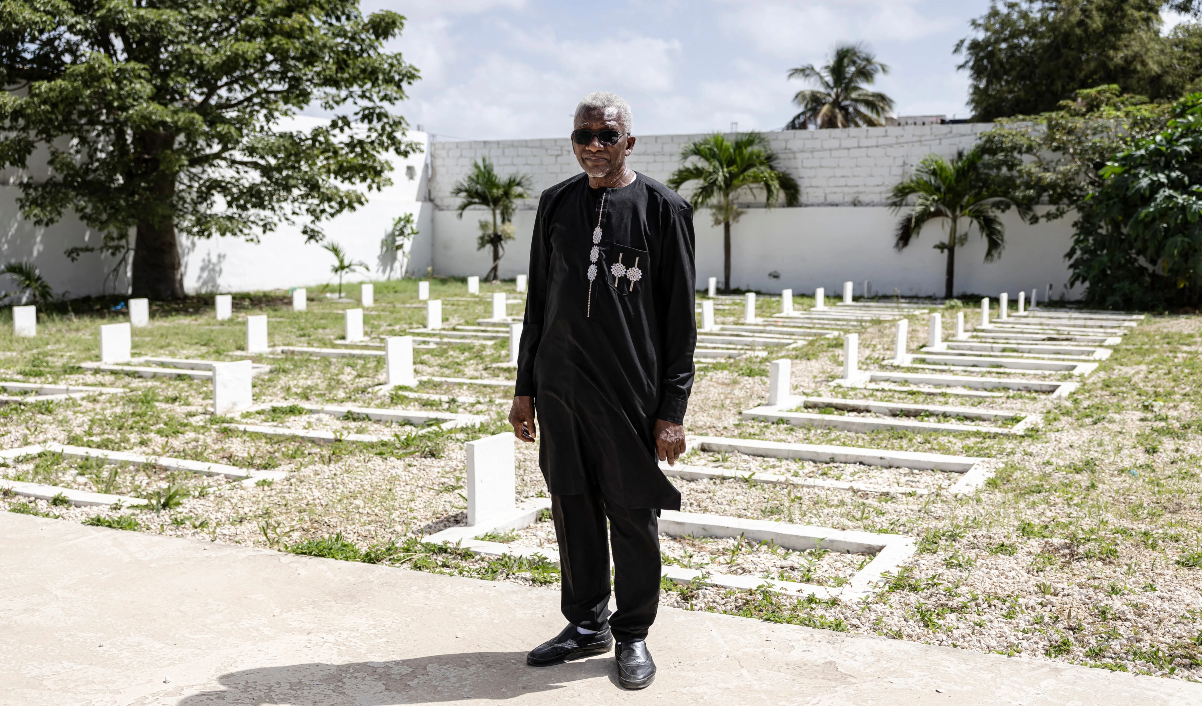 Mamadou Kone, technical advisor to the Director of Archives and Historical Heritage of the Armed Forces, poses for a portrait at the Thiaroye Military Cemetery in Dakar, on October 23, 2025. (Photo by PATRICK MEINHARDT / AFP) Mamadou Kone, technical advisor to the Director of Archives and Historical Heritage of the Armed Forces, poses for a portrait at the Thiaroye Military Cemetery in Dakar, on October 23, 2025. (Photo by PATRICK MEINHARDT / AFP)