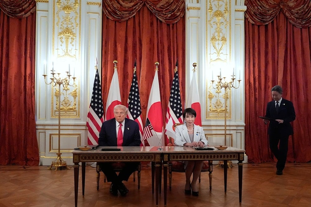 US President Donald Trump, left, and Japan's Prime Minister Sanae Takaichi attend a signing ceremony at Akasaka Palace in Tokyo, Japan, Tuesday, October 28, 2025. (AP Photo/Mark Schiefelbein)
