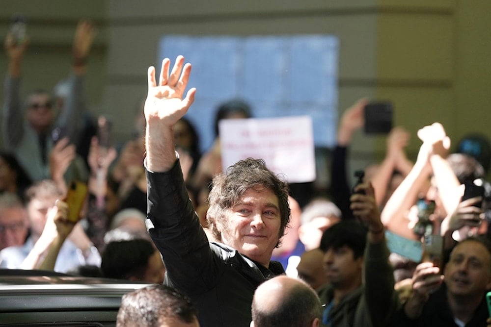 Argentina's President Javier Milei waves to supporters after voting during legislative midterm elections in Buenos Aires, Argentina, Sunday, October 26, 2025. (AP Photo/Natacha Pisarenko)
