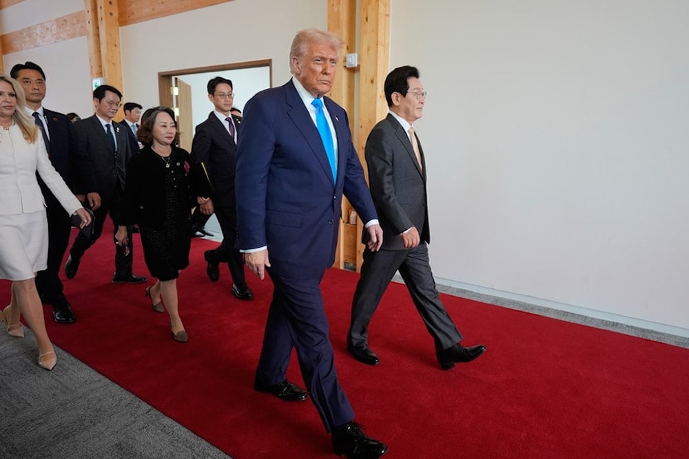 US President Donald Trump, center, and South Korean President Lee Jae Myung, right, attend a high honor ceremony at the Gyeongju National Museum in Gyoeongju, South Korea, Wednesday, October 29, 2025. (AP Photo/Mark Schiefelbein)