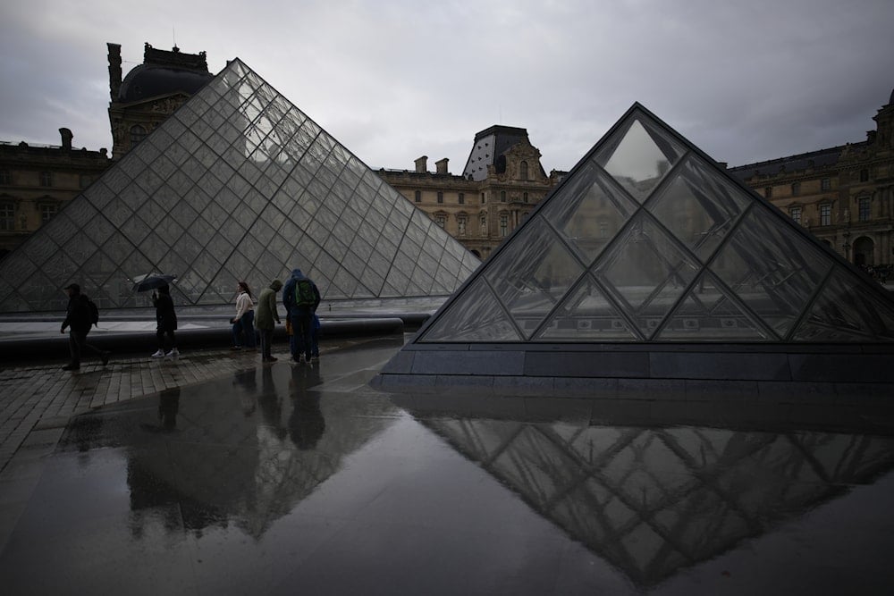 French Prosecutor will give updates, as two men face charges over the Louvre heist.