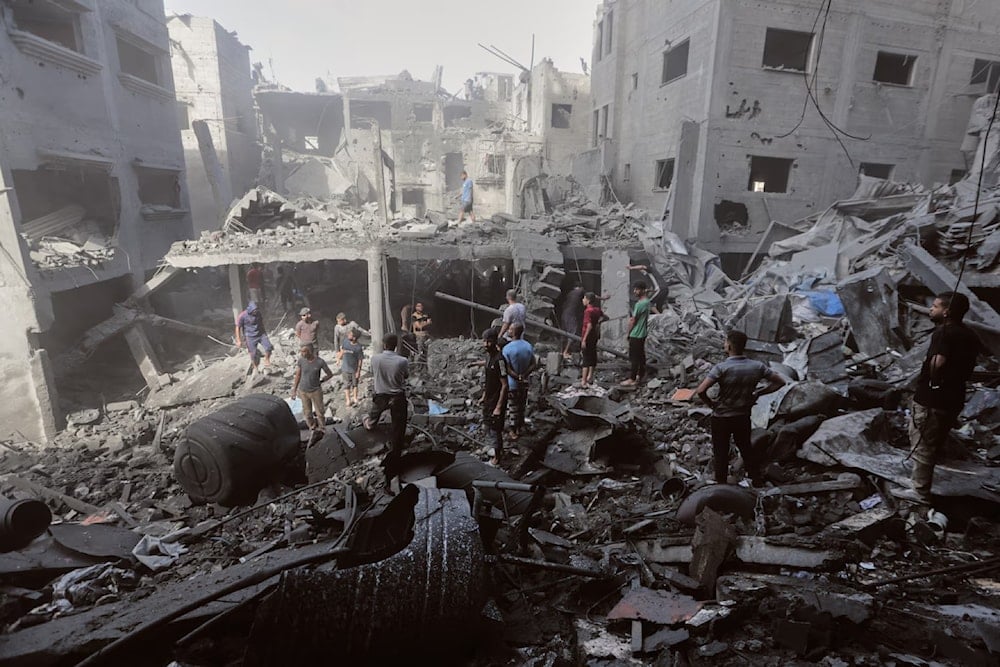 Palestinians inspect the rubble of a building, destroyed by an Israeli army strike at Al-Shati camp in Gaza City Wednesday, Oct. 29, 2025 (AP)