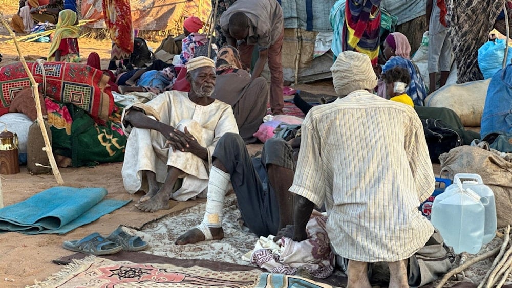 Displaced Sudanese who fled El-Fasher after the city fell to the Rapid Support Forces (RSF), rest near the town of Tawila in war-torn Sudan's western Darfur region (AP)