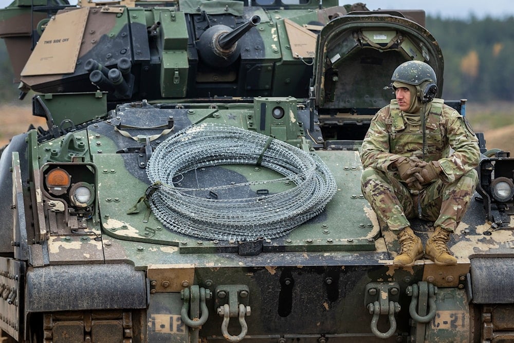 A soldier from the U.S. Army rests during a combined arms live fire military exercise 'Strong Griffon 2025' at a training range in Pabrade, north of the capital Vilnius, Lithuania, Wednesday, Oct. 29, 2025 (AP)