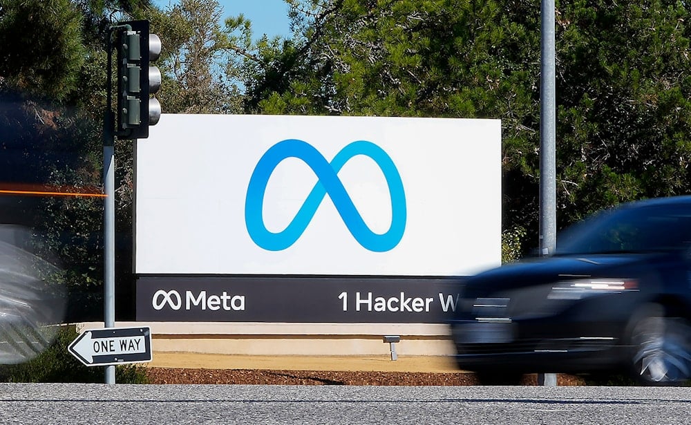A car passes Facebook's new Meta logo on a sign at the company headquarters on Oct. 28, 2021 (AP)