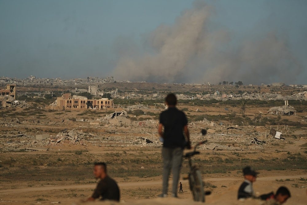 Smoke rises following an Israeli military strike in Gaza City, as seen from the central Gaza Strip, Wednesday, October 1, 2025 (AP)