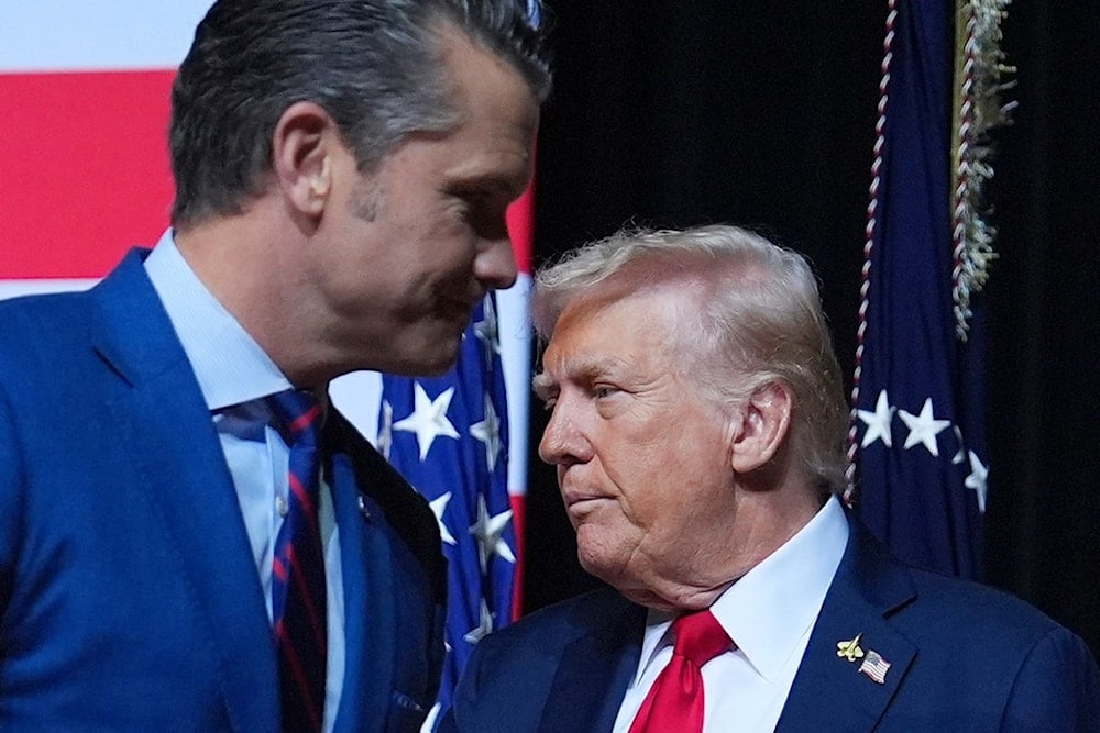 President Donald Trump is greeted by War Secretary Pete Hegseth before speaking to a gathering of top US military commanders at Marine Corps Base Quantico, Tuesday, September 30, 2025, in Quantico, Virginia (AP)