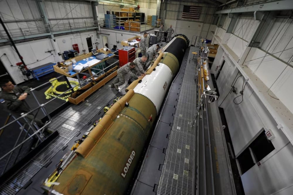 An undated photo of US Air Force personnel from the 576th Flight Test Squadron Missile Handling Team installing a cable raceway on an intercontinental ballistic missile at Vandenberg Air Force Base, California (Staff Sgt Jonathan Snyder/US Air Force)