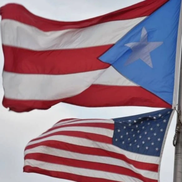 The US and Puerto Rican flags. (AFP)
