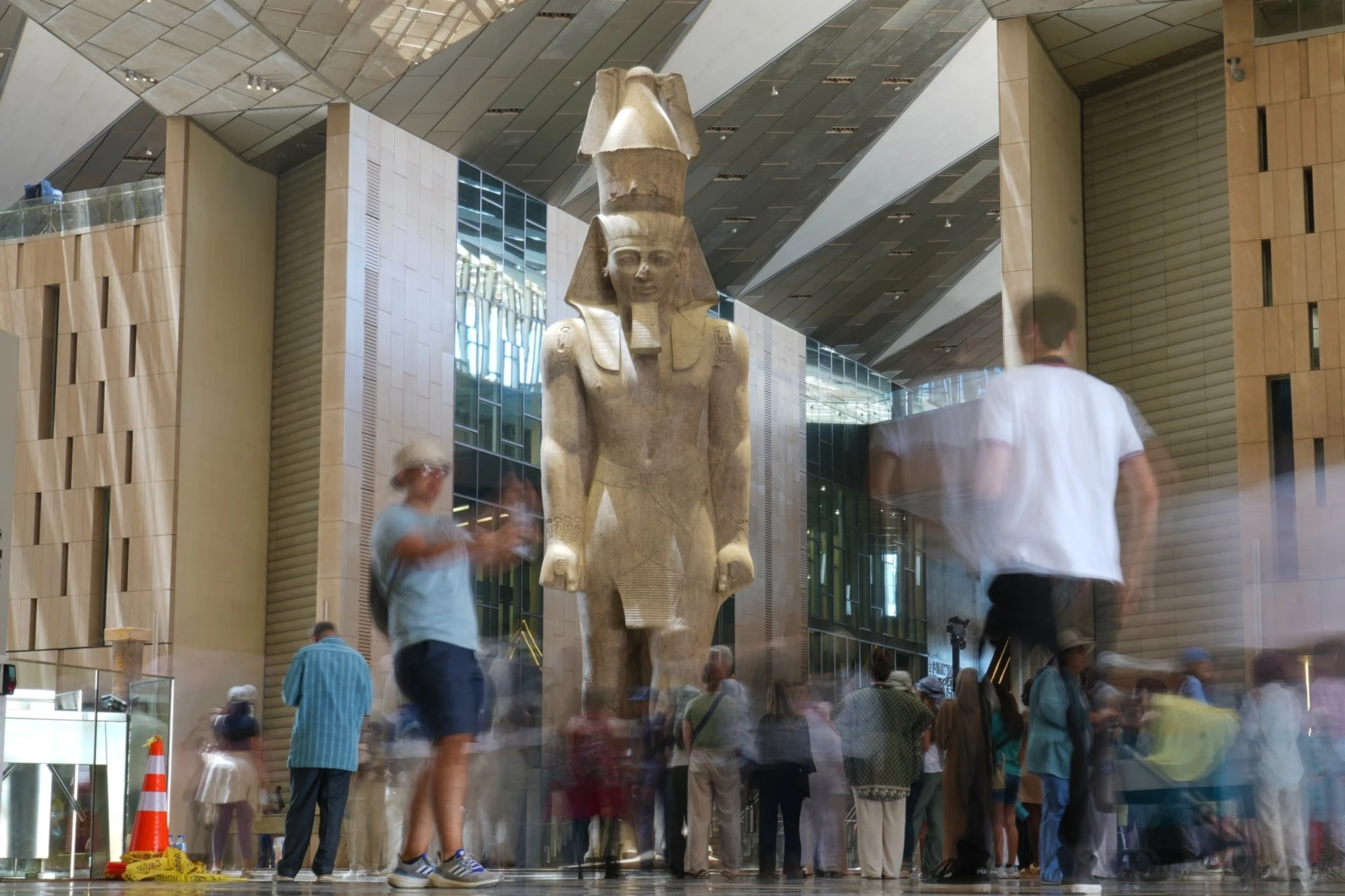 Tourists view the statue of Pharaoh Ramesses II on May 23, 2025 (Amr Nabil/AP)