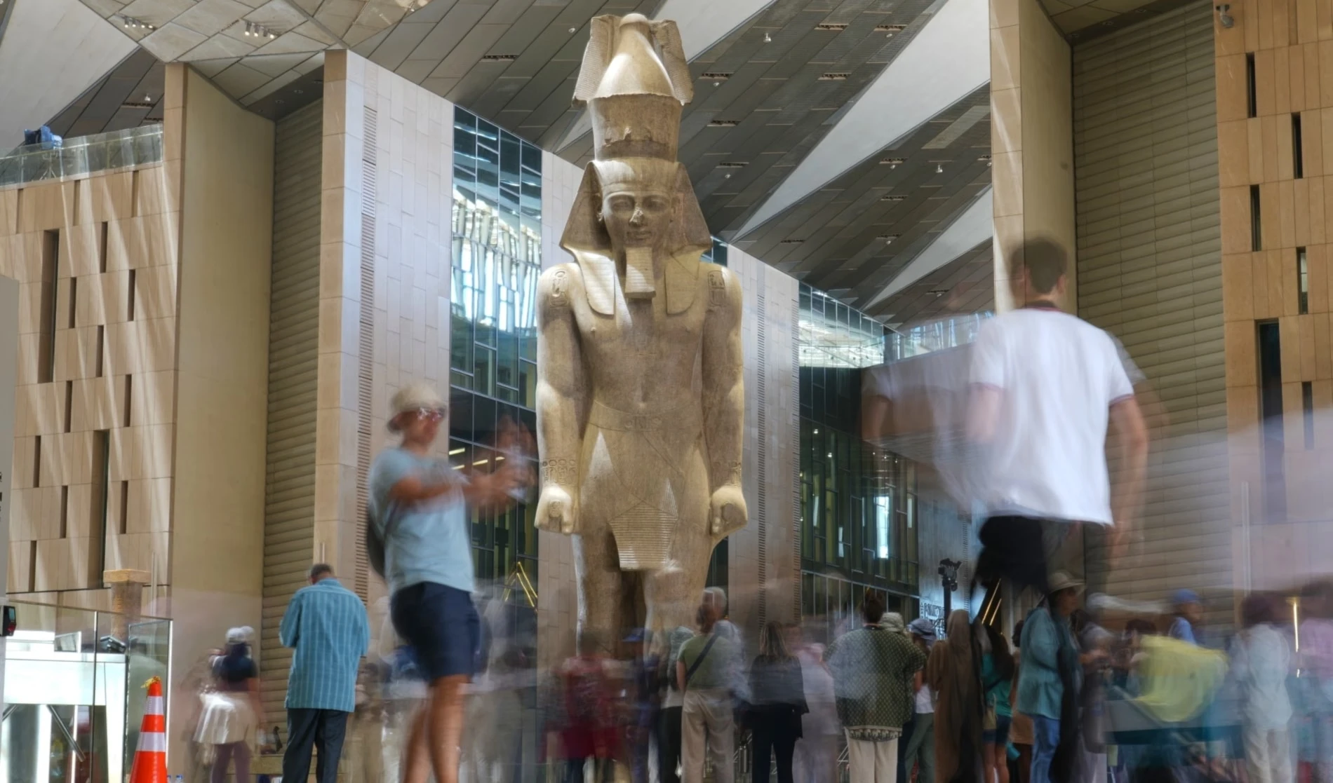Tourists view the statue of Pharaoh Ramesses II on May 23, 2025 (Amr Nabil/AP)