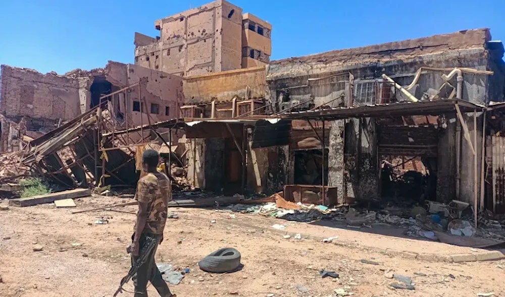 A Sudanese soldier patrols a market area in Khartoum on March 24, 2025. (Photo by AFP)
