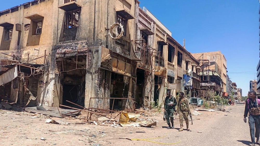 Fighters loyal to the army patrol a market area in Khartoum on March 24, 2025. (AFP via Getty Images)