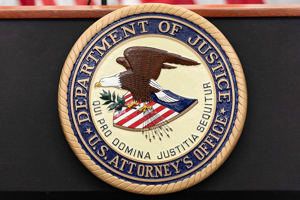 The seal of Department of Justice US Attorney's Office is seen during a news conference in Washington, Thursday, May 22, 2025 (AP)