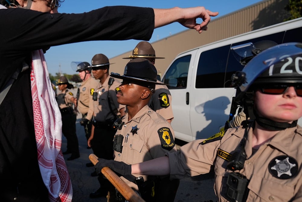 Law enforcement hold back protesters near an Immigration and Customs Enforcement facility in Broadview, Ill., Friday, Oct. 3, 2025 (AP)
