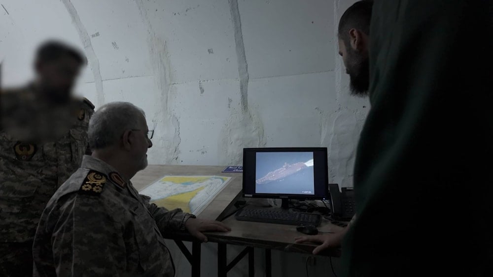 IRGC Navy Commander Mohammad Pakpour inspects drone footage of a US warship in Gulf waters as part of his inspection of the Iranian naval forces, October 5, 2025 (social media)